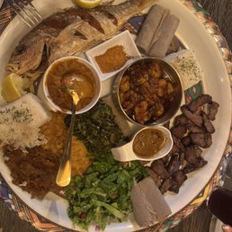Family style special with whole snapper fried, shrimp Tibs, shiro, ribeye and so much more. Also included are 2 sambusas Family style special with whole snapper fried, shrimp Tibs, shiro, ribeye and so much more. Also included are 2 sambusas