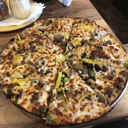 Supreme pizza (no anchovies). Medium with unlimited toppings, $9.99