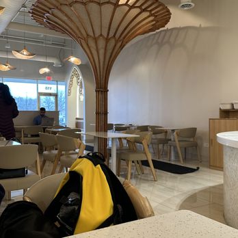 Arwa Yemeni Coffee - Photo showing a vertical decorative wooden structure that reaches from the floor to ceiling. - Coffee & Tea Near Me - Naperville, Illinois Arwa Yemeni Coffee - Photo showing a vertical decorative wooden structure that reaches from the floor to ceiling. - Coffee & Tea Near Me - Naperville, Illinois