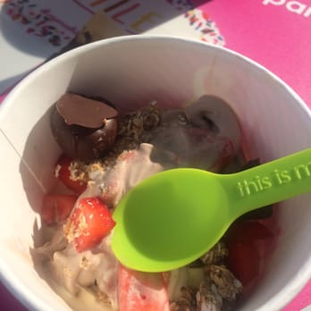 Menchie's Frozen Yogurt - Cake batter and salted caramel frozen yogurt, topped with granola, freshly cut strawberries, and chocolate covered cherries! - Desserts Near Me - Lansing, Michigan