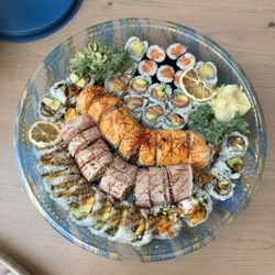 Shari Sushi & Maki - Top to bottom: unagi, scallop, salmon, salmon avocado makimono, and orange dragon, red dragon, dynamite rolls