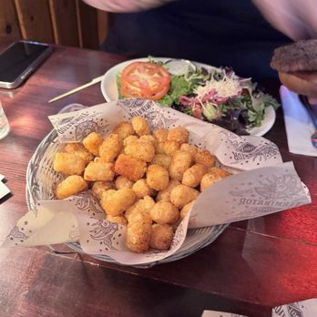 McMenamins Lighthouse Brewpub - The cold "Cajun" tots and my wife's hot sald and cold burger behind them. - American Near Me - Lincoln City, Oregon McMenamins Lighthouse Brewpub - The cold "Cajun" tots and my wife's hot sald and cold burger behind them. - American Near Me - Lincoln City, Oregon