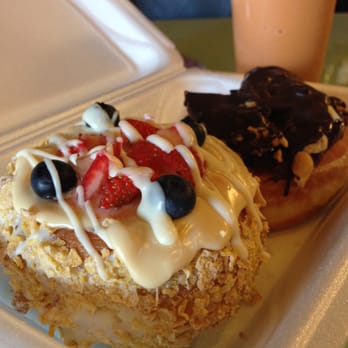 Mojo Donuts - Deco Delight in white and I forget the donut behind it but it had chocolate and peanuts - Donuts Near Me - Pembroke Pines, Florida Mojo Donuts - Deco Delight in white and I forget the donut behind it but it had chocolate and peanuts - Donuts Near Me - Pembroke Pines, Florida