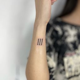 angel number tattoo done by Will