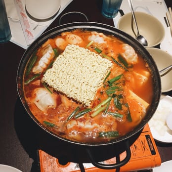 Funny Plus - Budaejjigae! Huuuuge portion with lots of goodies like dumplings, sausages, rice cakes, and ramen. - Korean Near Me - Aurora, Colorado