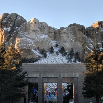 Mount Rushmore National Memorial - Daytime view from the entrance to the Monument - Landmarks & Historical Buildings Near Me - Keystone, South Dakota Mount Rushmore National Memorial - Daytime view from the entrance to the Monument - Landmarks & Historical Buildings Near Me - Keystone, South Dakota