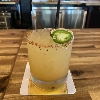 Rebels Burger and Brew - A delicious invention by Ryan! Jalapeño-infused tequila with ingredients like house-made peach syrup and tajin. Great cocktail! - Burgers Near Me - Yucaipa, California