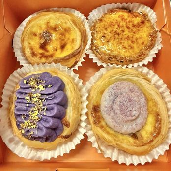 Na Tart - Top (L-R): Original Portuguese Egg Tart, Creme Brûlée Egg Tart Bottom (L-R): Ube Cheese Tart, Taro Egg Tart - Bakeries Near Me - San Diego, California Na Tart - Top (L-R): Original Portuguese Egg Tart, Creme Brûlée Egg Tart Bottom (L-R): Ube Cheese Tart, Taro Egg Tart - Bakeries Near Me - San Diego, California