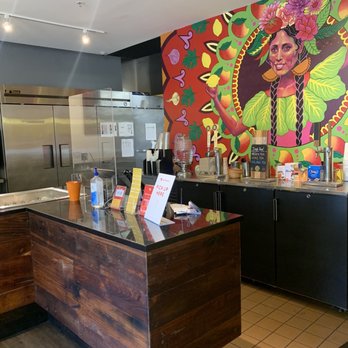 Bombolé - Cashier and beautiful mural - Indian Near Me - Tucson, Arizona Bombolé - Cashier and beautiful mural - Indian Near Me - Tucson, Arizona