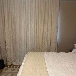 Bedroom Belgian textured linen ripple fold drapery.