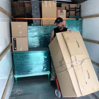 EZ Move - Travis dollying up a piece to make the fit for the load. - Movers Near Me - Astoria, Oregon