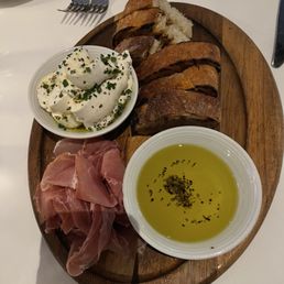 Bread service with ricotta cheese and prosciutto
