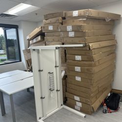 En-Clear Junk Removal - Stacking cardboard to dispose of after assembly.
