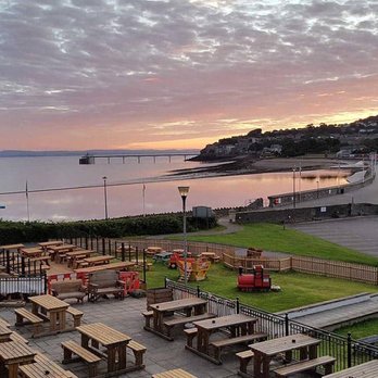 The Salt House - seating area outside the salthouse pub at sunset - Pubs Near Me - Clevedon, NSM