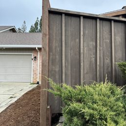 a house with a fence and a driveway