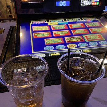 The MINT Tavern - two drinks in front of a slot machine - Cocktail Bars Near Me - Las Vegas, Nevada The MINT Tavern - two drinks in front of a slot machine - Cocktail Bars Near Me - Las Vegas, Nevada