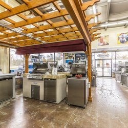 Best in Backyards Indoor Design Center with Grills and Kitchen Islands
