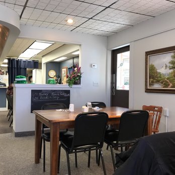 Johnny's Skillet - a man sitting at a table - New American Near Me - Austin, Minnesota Johnny's Skillet - a man sitting at a table - New American Near Me - Austin, Minnesota