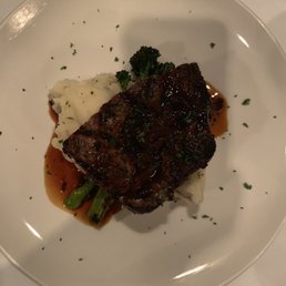 Half of the 16 oz ribeye with garlic smashed potatoes and broccolini. Half of the 16 oz ribeye with garlic smashed potatoes and broccolini.