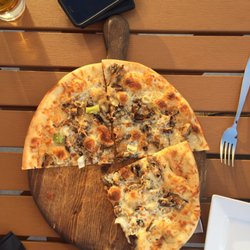 Fun Guy thin crust pizza on the patio