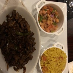 Awaze tibs (beef), tomato salad and Mediterranean rice Awaze tibs (beef), tomato salad and Mediterranean rice