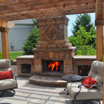 Greenleaf Landscaping - Paver Patio and stone fireplace under a pergola - Landscaping Near Me - Greenwood, Indiana Greenleaf Landscaping - Paver Patio and stone fireplace under a pergola - Landscaping Near Me - Greenwood, Indiana