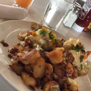 Four Friends Kitchen - Amazing egg Benedict with fried chicken, sausage gravy, potatoes and biscuits. YUM YUM. - Southern Near Me - Denver, Colorado Four Friends Kitchen - Amazing egg Benedict with fried chicken, sausage gravy, potatoes and biscuits. YUM YUM. - Southern Near Me - Denver, Colorado