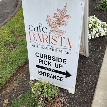 Cafe Barista - Suffield - A white outdoor sign for Cafe Barista in Suffield, CT, displays menu items and directs customers to curbside pickup and entrance with an arrow. - Coffee & Tea Near Me - Suffield, Connecticut