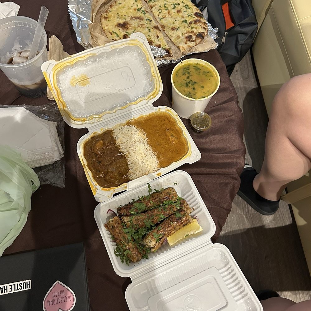 Kabob plate, 2 item plate with lamb vindaloo, chicken korma and rice, daal, and garlic naan.