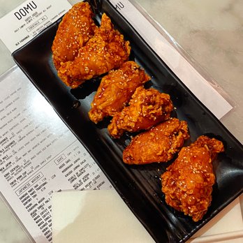 DOMU - Dr. Phillips - "DOMU WINGS" 6 extra crispy wings coated w/Kimchi butter sauce and sesame seeds. - Ramen Near Me - Orlando, Florida DOMU - Dr. Phillips - "DOMU WINGS" 6 extra crispy wings coated w/Kimchi butter sauce and sesame seeds. - Ramen Near Me - Orlando, Florida