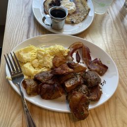 Eggs, bacon breakfast potatoes and hotcake