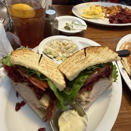 Club sandwich and short stack of pancakes Club sandwich and short stack of pancakes