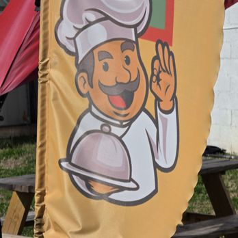 Absolutely Delicious Bar and Grill - A banner with the word Restaurant on it is shaken by the wind to attract the attention of the public. - Burgers Near Me - Vinton, Virginia
