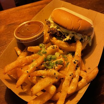 Paradise Chow - a basket of fries and a sandwich - Tiki Bars Near Me - Birmingham, Alabama Paradise Chow - a basket of fries and a sandwich - Tiki Bars Near Me - Birmingham, Alabama
