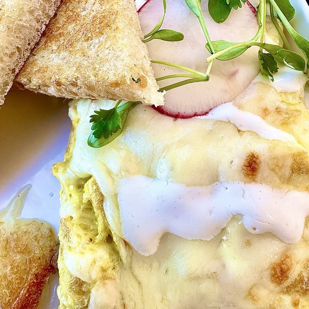 El Bistro By Salt And Pepper - Chili Relleno omelette with a side of fresh berries and sourdough bread. - Salad Near Me - Tracy, California El Bistro By Salt And Pepper - Chili Relleno omelette with a side of fresh berries and sourdough bread. - Salad Near Me - Tracy, California