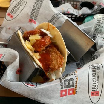 Hurricane Grill & Wings - a wrapper of a chicken taco - Chicken Wings Near Me - Palm City, Florida