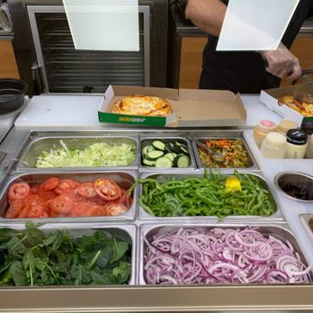 Subway - a salad bar with a variety of vegetables - Sandwiches Near Me - Mokena, Illinois