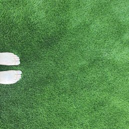 Bare feet on fresh turf.
