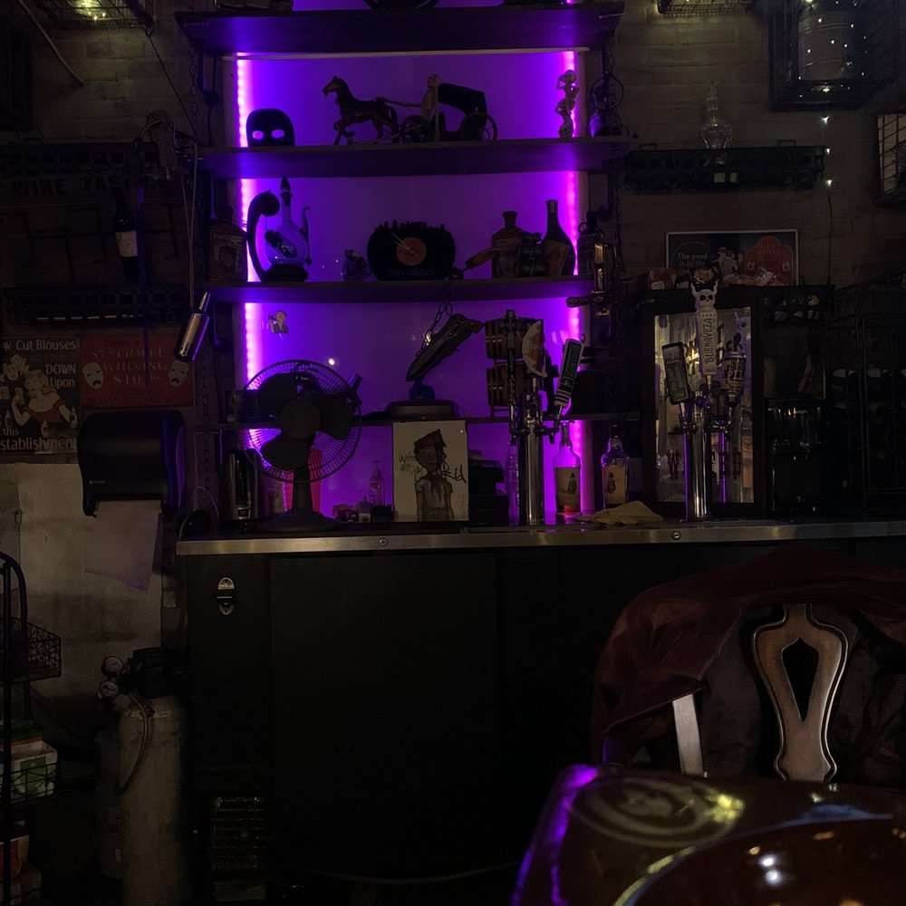 a bar with purple lighting