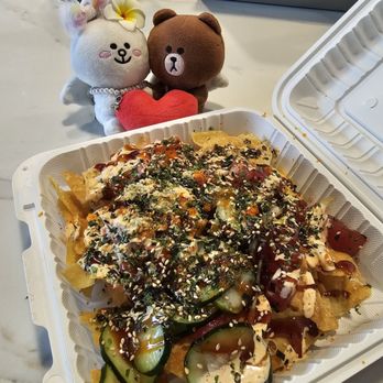 Ry’s Poke Shack - Tsunami Nachos... crab salad, Furikake, tobiko, tsunami style poke, unagi sauce, & chili-mayo drizzle on a bed of fried wonton chips - Poke Near Me - Urban Honolulu, Hawaii