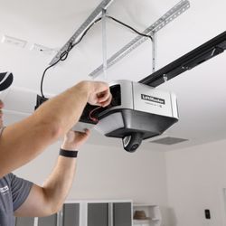 Revel Garage Solutions - Technician installer new Liftmaster Operator