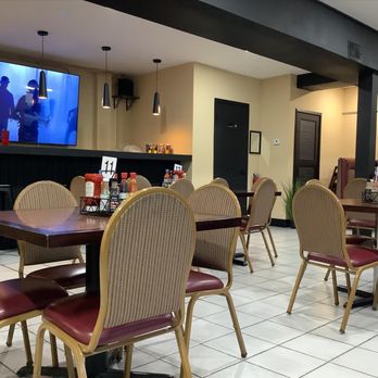Casa De Luz - a dining area with a flat screen tv - Mexican Near Me - Hammond, Indiana