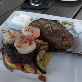 Oceanview Terrace Bar and Grill - Petite filet with add in shrimp, baked potato, and grilled veggies - Bars Near Me - Daytona Beach, Florida