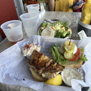 The Old Salty Dog - Blackened grouper sandwich. Side Caesar with coleslaw. Not bad. - Seafood Near Me - Sarasota, Florida The Old Salty Dog - Blackened grouper sandwich. Side Caesar with coleslaw. Not bad. - Seafood Near Me - Sarasota, Florida