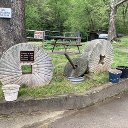 Linney's Water Mill and Campground - Water millstones marking milestones