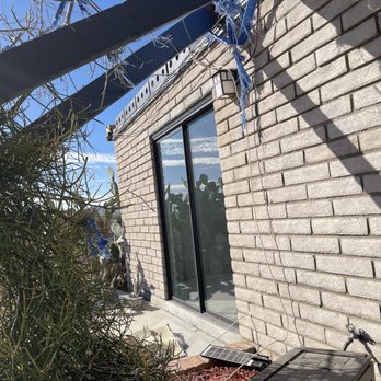 AAA Orem Branch - Another photo of patio cover missing, blown over home. Fall on anyone on the patio death risk. - Insurance Near Me - Orem, Utah