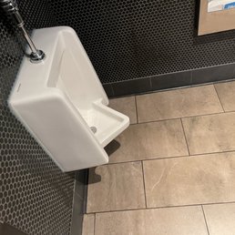 a urinal in a public restroom