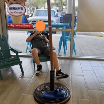 Scratched Ice - Relaxing & thoroughly enjoying his cookies n cream ice cream at Scratched Ice. - Shaved Ice Near Me - Orlando, Florida
