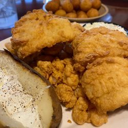 King of the Sea Seafood Restaurant - Flounder with Popcorn Shrimp, Baked Potato and Hushpuppies.