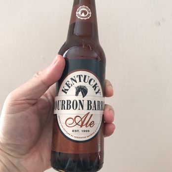 Thrifty Beverages - a hand holding a bottle of bourbon barrel ale - Beer, Wine & Spirits Near Me - Brooklyn, New York Thrifty Beverages - a hand holding a bottle of bourbon barrel ale - Beer, Wine & Spirits Near Me - Brooklyn, New York